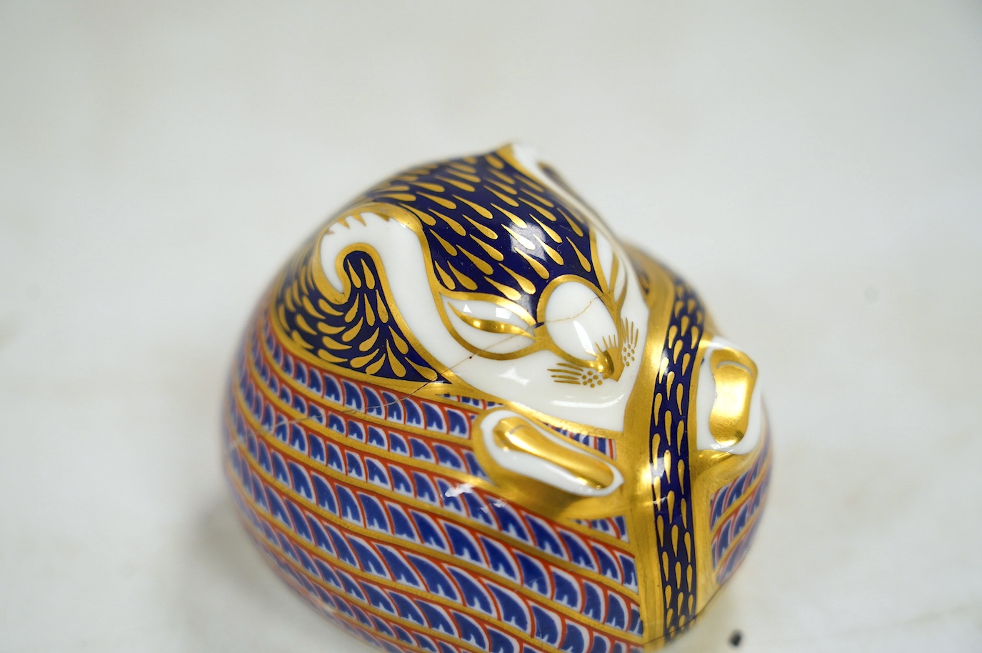 Eight Royal Crown Derby porcelain paperweights in the form of animals including a penguin, rabbit and seal, largest 17cm wide. Condition - seven good, one broken